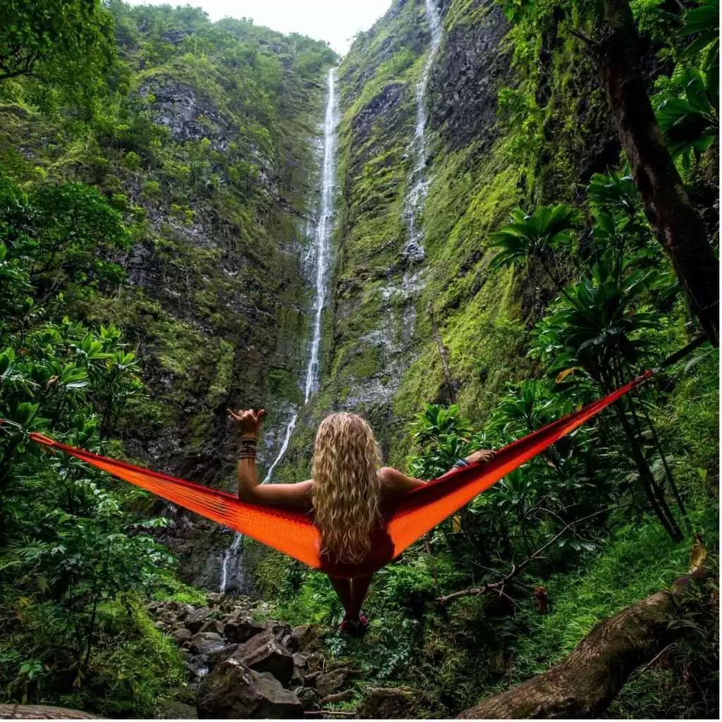 Girl in front of a Waterfall in Hawaii